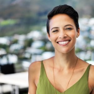 Portrait of an attractive young woman standing outside