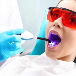 Woman at the dentist's chair during a dental procedure